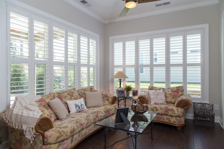 Traditional sunroom with faux wood shutters in Phoenix.